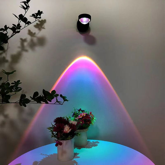 Rechargeable sunset wall lamp projecting warm ambient light