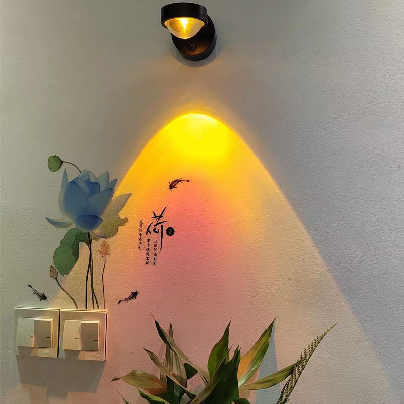 Rechargeable sunset wall lamp projecting warm ambient light